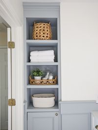 A small bathroom makeover with lots of DIY projects to maximize storage and space on a budget! A budget bathroom makeover that is functional and pretty! Bathroom storage ideas and built in bathroom shelves. #bathroommakeover #smallbathroom #bathroomremodel