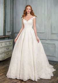 Willa by #JustinAlexanderSignature Feel like royalty in this off the shoulder allover lace #weddingdress accented by soft embroidery details. The long cathedral length train with hem lace helps make this gown a statement piece. Light Gold/Ivory, Ivory/Ivory
