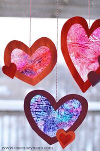 Let the kids make a homemade suncatcher for the perfect Valentine's Day Craft. They will love this heart suncatcher and it's so simple to make. Try this easy Valentine craft for kids!