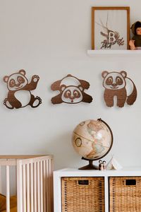 Home interior accent for unique home and office wall decor for panda lovers. This laser-cut design is especially suitable for decorating a child's room. Nursery wall decor consists of a 3-piece set with cute pandas. The pandas wall decor is ready for hanging on the wall. The decor is attached with adhesive tape on the back of the decoration. #babyroomdecor #kidroomart #pandawallart #funnydecoration #babybear #housewarming
