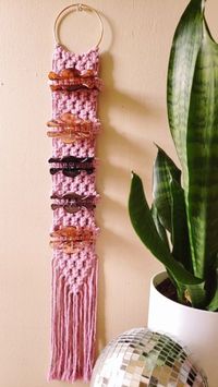 Emily Ball | Home Decor & Accessories on Instagram: "Available in 6 lengths and 12 colors! Also check out the PDF pattern if you want to make your own 💕 . . . . . . #macrame #macramewallhanging #macramewalldecor #macramewallart #wallhanging #macrameallday #macramemakesit #macramemakers #macramecommunity #bohoaesthetic #bohome #bohomacrame #bohostyle #clawclip #clawclipholder #hairclips #haircliporganizer #hairclipaccessories #hairaccessories #hairclip #macramepattern #macrametutorial #macrametu