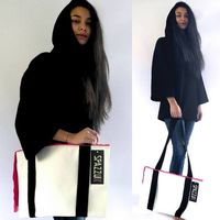 Faux leather bag oversize with long strap in grosgrain, twin handles, long zip and 2 internal pockets. You can choose between different combination of colors. Every bag is an unique piece 100% Made in Italy, hand sewn by our artisans with high quality materials. Measurements: 30 x 40 cm Material: 100% Polyester Garment Care: Do not wash