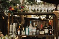 Rustic + quirky liquor display | Image by Heirlume Photography