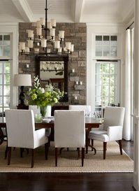 Nice dining room. Love the stone wall.