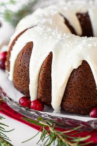 This moist, velvety gingerbread cake is a decadent take on a classic holiday treat, drizzled with a thick, rich, vanilla sour cream icing! | thecozyapron.com #gingerbreadcake #gingerbreadcakerecipe #gingerbreadbundtcake #gingerbreadcakesourcreamicing