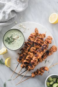 These Moroccan Chicken Skewers with Lemony Feta Tzatziki are marinated in a garlicky yogurt marinade, then grilled on skewers and served with a creamy, lemony tzatziki sauce! They are packed with TONS of flavor, and make a perfect dinner alongside roasted or grilled vegetables!