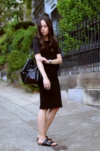All Black Outfit with a midi skirt, Birkenstock Arizona sandals and Balenciaga City Classic