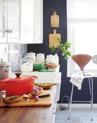 french country kitchen - love the tile, butcher block, enamelware and farmhouse sink.