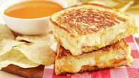 Grilled cheese goes gourmet with this elevated take on the classic sandwich. Made with Gruyère, cheddar and American cheeses, this three-cheese grilled cheese sandwich with bacon takes a childhood favorite to new, delicious levels.