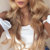 Golden locks of gorgeous strawberry blonde hair, brushed out curls.
