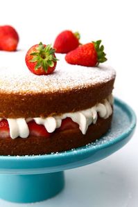 This easy vegan sponge cake recipe will amaze you! Light, fluffy, and spongy cake layered with strawberries and cream, this cake will not disappoint!