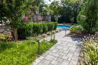 Modern pathway idea. For this landscape project, the Mista permeable pavers were used in a randomized pattern to give interest. As these pavers are permeable, they are perfect if you're looking for an eco-conscious solution. Visit our landscape stones at www.techo-bloc.com. #patio #backyard #retainingwalls #landscapesteps #landscapestoneedging