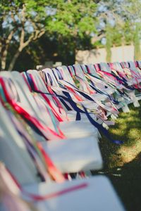 What a fun way to add some color and personality to ceremony chairs! photo by Christina Carroll | via junebugweddings.com
