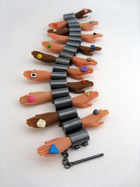 Deconstructed Barbie Jewelry by Margaux Lange - Margaux Lange decapitates (and dismembers) Barbie dolls, but she uses the doll parts to create surprisingly beautiful and artistic jewelry.
