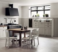 Unprecedented aged bronze effect cup handles and a new cupboard with a rounded top profile make up the distinguishing elements of this industrial chic solution, which perfectly match the Tabula workshop-style console table. Shabby chic kitchen ideas.