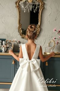 "Our adorable flower girl dress is perfect for a wedding, birthday, first communion, family photo shoot or any other occasion. Dress colors: This dress can be made in ivory or white color. If your event has a specific color, feel free to contact me and I will be happy to customize the color of the dress match the color of your event. The shade of fabrics may vary slightly depending on the supply of fabrics. If you order a dress for one event with my other customer, please write about it in the c