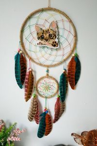 Cat dream catcher, cat lover gift, cute kitten gift, bedroom wall hanging decor. Made with attention and love this dream catcher brings its owners good dreams and positive energy. A perfect addition to any room where magic is required to keep bad dreams away. Dreamcatcher ring is 6 inches across. This dream catcher would be the perfect addition to any room or even make a great gift! In traditional teachings, dreamcatchers trap bad dreams, only allowing the good to filter through.
