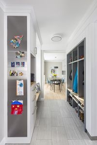 A view from the entry, through the superfunctional mudroom and into the sunlit dining room - Fine Homebuilding #Mudrooms #MudroomDesign #FunctionalHome #Organization #OrganizedHomes #Cubbies #Kitchens