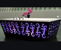 Luxury Backlit Bathtub- The new bathroom of GHG is the brainchild of design duo Catherine and Bruno Lefebvre. The border between the Baroque and the modern, luxurious bath combines beautiful aesthetics, ergonomics and technology in one. The thick black bath has a distinctive square shape, decorated with artistic cut outs, background lighting in a variety of colors