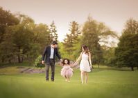 family walking together field