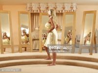 Stock Photo : Senior woman standing in front of mirror