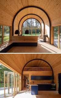 A Curved Corrugated Metal Roof Creates An Impressive Vaulted Ceiling Inside This Cabin