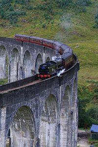 Jacobite train (Hogwart's Express)going over the Glenfinnan Viaduct in Scotland...