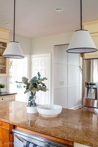 I knew when we moved into our home that I was going to be making a few adjustments to our kitchen. It's not 100% my style but I knew I could make it my own with a few projects. Painting the walls was my first task. And thanks to my son who "accidentally" flooded the upstairs bathroom and ruined our ceilings in the kitchen, painting of the kitchen was expedited. We will refer to him from now on as the "Wet Bandit". Also thanks to the 8 year old Wet Bandit I had to remove the pot rack…