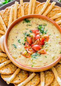 Crockpot Queso Blanco Dip - super cheesy queso blanco dip with my favorite ingredient; bacon! Perfect snack or appetizer for the holidays. #queso #dip #appetizer