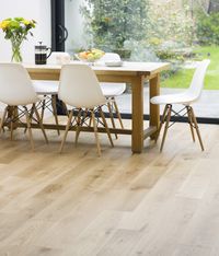 Light and natural oak for a classic yet modern finish. I also love the chairs. Easy to maintain. Very affordable knock offs. :)