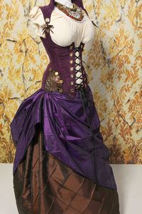 Two pintuck swagger / full length skirts. Pintuck refers to the fabric type, with a diamond pintuck pattern. Pintuck fabric can be used in several skirt types. Full length / swagger skirts can be layered, swagged, bustled, and hiked up as shown!