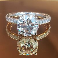 Custom made solitaire hidden halo engagement ring