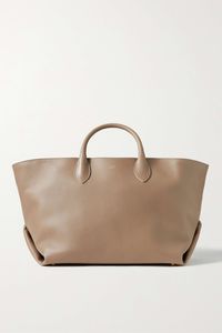 Khaite's medium-sized 'Amelia' tote is ideal for long commutes or day trips. Crafted from leather, it has sculptural folds and protective feet at the base. The spacious interior has a zipped pocket to keep small items close at hand.