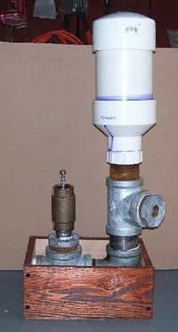 Build this Atlas Ram Pump. It can pump water from a flowing source of water to a point ABOVE that source with no power requirement other than the force of gravity.