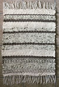 This little rag rug is handwoven from strips of thrifted cotton fabric and wool yarn, in subtle diamond patterns and zigzags. The texture is unbeatable, and it makes a gorgeous addition to any space as a layering accent rug! Toss it in front of your sink or over another rug to