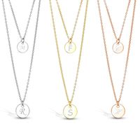 Personalized Double Layered Stainless Steel Round Charm Necklace Add a dash of charm to your everyday look with this Personalized Double Layered Stainless Steel Round Charm Necklace. This dainty necklace features two strands of chain link with a circle pendant designed to hang loose on your neck. The circle pendants can be personalized with your couple initials and makes a great anniversary or milestone gift for the special lady in your life.
