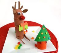 This little cardboard reindeer and his holiday tree are the cutest project that kids and adults can make as a holiday or Christmas project