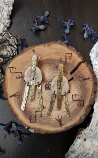 Created by YorKa crafts. Handmade texturized brass studs with antler pieces.