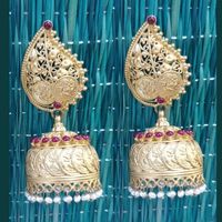 Product Details: Base Material - 92.5 Carat Pure Silver with Gold Plating Technique - Handcrafted Product Type - Temple Jewellery Design - Jhumka Colour - Red Length - 6 cm Width - 2.5 cm Care Instructions - Avoid Contact with Perfumes and Water Contact No - +91 8095752326 E-Mail - contactus@madhurya.com Also available in Pure Gold* Shipping Worldwide