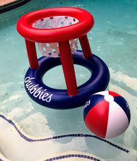 Pool party games take on their own life with an inflatable floating basketball hoop and ball. #poolpartygames #poolpartytoys