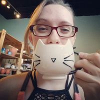 I made a kitty face mug! #kaitlynceramics #kaiceramics #kai #mudfire #madeatmudfire #handmade #handmadepots #kitty #kittyface #cat #catmug #catfacemug #selfie #selfiewithpottery #cutemug #mugshot