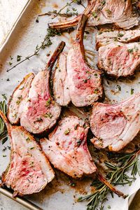 This easy Roasted Rack of Lamb recipe makes the most elegant family or holiday dinner. Easter dinner idea anyone? Use high quality ingredients like a top cut of lamb, fresh herbs, and rich extra virgin olive oil, for a simple but show stopping meal. #lamb #easterdinner