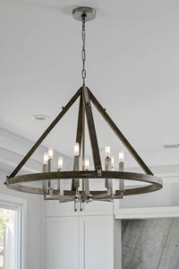 This stunning Modern Farmhouse is a family friendly home not lacking in sophistication or elegance. This home features Signature Custom Cabinetry throughout, with captivating light fixtures perfect for every space. #kitchenideas #modernfarmhouse #kitchenlighting #islandlighting #kitchenlightingideas