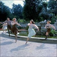 This is a great shot I've never seen. This is them dancing around the fountain in Mirabell Palace with them all in the air. This is that great scene in "Do Re Mi" where they dance around the fountain and then come forward. That's really cool.