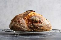 This recipe produces a loaf of bread with significantly improved hole structure and flavor compared with this no-knead version (inspired by Jim Lahey’s original no-knead bread recipe), and requires not much extra work Increasing the water content produces bread with a more custardy crumb and a more open, holey structure Adding a few turns during the initial fermentation stage gives this wetter dough strength, letting it better retain its hole structure as it’s shaped