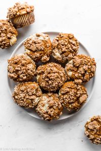Stuff these deliciously spiced and soft pumpkin muffins with cream cheese cheesecake filling and top with buttery brown sugar crumb cake topping. You'll never crave another pumpkin muffin recipe again! sallysbakingaddiction.com