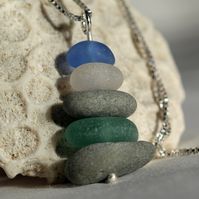 An ocean cairn necklace of sea glass and beach pebbles to remind you of your favourite days at the ocean's edge! #seaglassjewelry #oceaninspired #giftformom #artisanjewelry