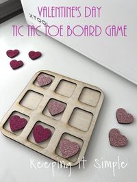 This Valentine's Day Tic Tac Toe board game is super easy to make and would make a great game for class party or it could be used in the car or just at home. Adding glitter heat transfer vinyl to the wood makes it even more fun!