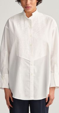 Cute white collarless blouse: stand collar, long sleeves. Pearl buttons. Cotton. Inspirational button placket design. Loose fit. Womens / unisex #inspo #inspiration #buttons #loops #whiteshirt #women #womensoutfits #blouse #collarless #cotton #style #design #sewing #tailoring #outfits #tops #collarless #standcollar #vintage #style #henley #tops #fashion #casual #weddingshirt #bohohippie #ootd #looseshirt #2023