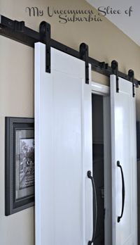 Barn-Doors-for-the-Laundry-Room- this is a good example for how the sliding door can clear our pictures. I plan to do this for our pantry.
